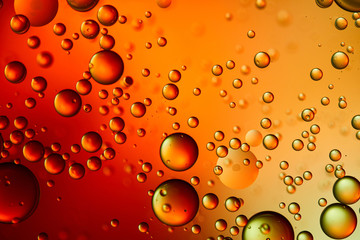 Beautiful abstract background from mixed water and oil in orange and red color