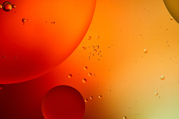 Beautiful abstract background from mixed water and oil in orange and red color