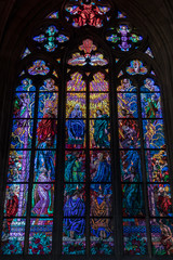 Prague, Czech Republic: Colorful religious stained glass window inside St. Vitus Cathedral