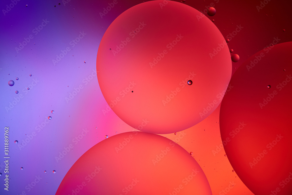 Sticker Beautiful abstract background from mixed water and oil bubbles in pink and purple color