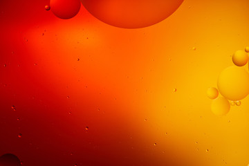 creative abstract orange and red color background from mixed water and oil