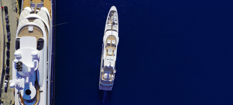 Aerial drone ultra wide photo of luxury mega yacht with wooden deck cruising Aegean deep blue sea - Powered by Adobe