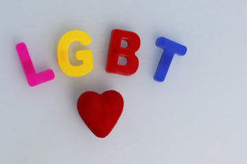 LGBT community symbol on a white background and red heart. Human rights, equality. Sign for lesbians, gays, bisexuals and transgender people.  LGBT concept. Copyspace for text.