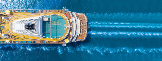 Aerial view of beautiful white cruise ship above luxury cruise close up at stern of cruise sail with contrail in the ocean sea  concept smart tourism travel a vacation time on summer, webinar banner - obrazy, fototapety, plakaty