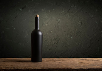 Wine tasting experience in the rustic cellar and wine bar: red wine glass and collection of...