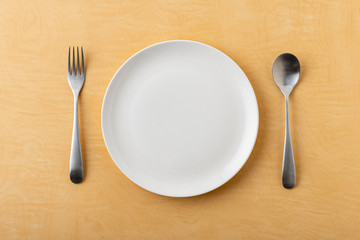 Empty plate spoon and fork