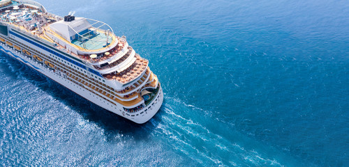 Aerial view of beautiful white cruise ship above luxury cruise close up at stern of cruise sail with contrail in the ocean sea  concept tourism travel take a vacation time on summer., webinar banner - obrazy, fototapety, plakaty