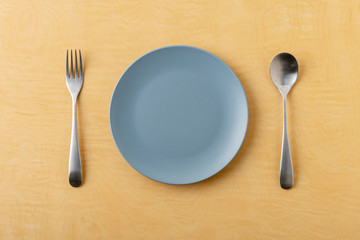 Empty plate spoon and fork