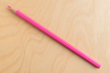 Pink Color Pencil Isolated On Wood Background