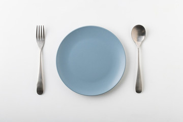 Empty plate spoon and fork