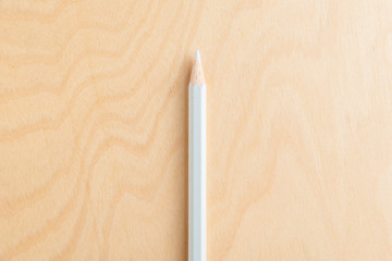 White Color Pencil Isolated On Wood Background