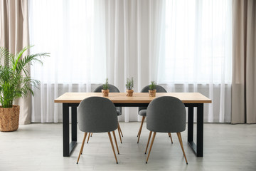 Modern room interior with chairs and table