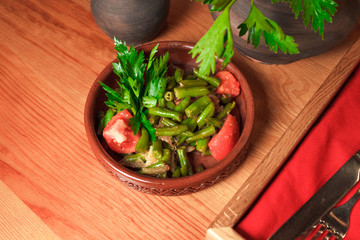 Georgian green bean dish on a table of a restaurant. Dish of Georgian cuisine