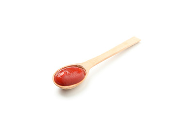 Wooden spoon with sauce isolated on white background