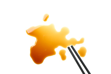 Soy sauce spot isolated on white background, top view
