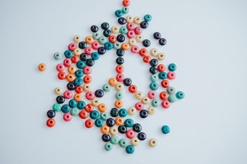 colorful beads with peace symbol on a white background