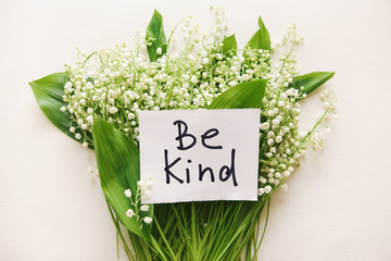 Be kind - calligraphy lettering with bouquet of flowers, motivation phrase about goodness