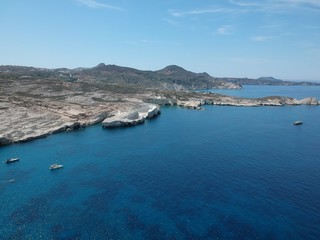 Milos, Greece Papafragas Beach and Caves view from the drone with visitors at sunny weather