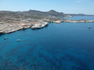 Fototapeta na wymiar Milos, Greece Papafragas Beach and Caves view from the drone with visitors at sunny weather