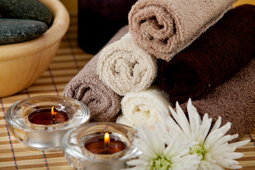 Fototapeta na wymiar Spa accessories, candles aroma oils and face towels