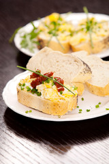 Delicious fresh scrambled eggs and dried tomatoes sandwich