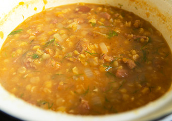 Thick pea soup with dill and chicken, close-up