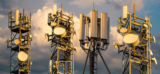 base stations and mobile phone transmitters against the background of the evening sky.