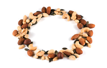 Frame made of different types of nuts on white background