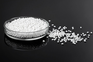 Closeup of a white plastic polymer in granules