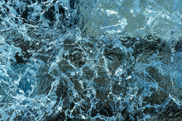 photo frosty winter pattern in frozen water