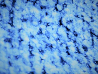  close-up of decorative abstract wall surface with blur / bokeh effect in classic blue color