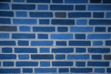 Brick wall texture toned trendy classic blue color of year 2020. copy space 