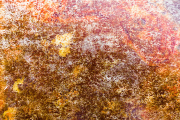 Detail shot of old rusty metal in orange tones