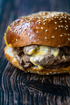 Steak Burger made with Lamb Meat Lokum and Cheddar Cheese / Hamburger or Cheeseburger on Wooden Surface.