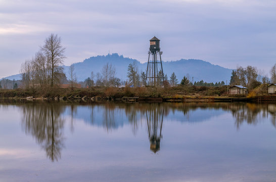 Cheadle Lake with a reflection of Peterson Butte and the Weldwood water tower