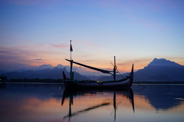 Traditional fishing vessels that still use traditional fishing gear, this boat is made of wood that is resistant to sea water. Fishing boats dock at the seashore.