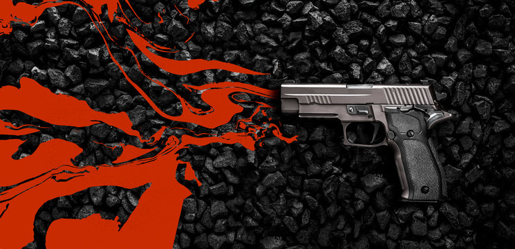 Pistol seen from above lying on the background