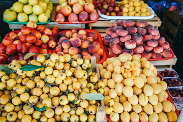 Fresh fruit in the market. Apricots, peaches on the market.