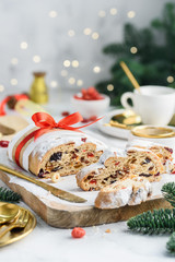 Fototapeta na wymiar Christmas stollen on wooden board. Traditional Christmas festive pastry dessert.