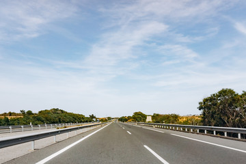 Fototapeta premium Paved road and beautiful green landscape in summer