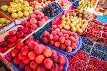 Fresh, juicy fruits at a market under the open sky