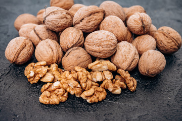 Walnuts on black background are ready to eat.