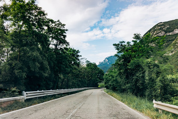 Scenic road in near the mountains. Picturesque view from the car window.