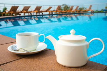 tea set on plate near spa pool