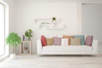 Stylish room in white color with sofa and colorful pillows. Scandinavian interior design. 3D illustration