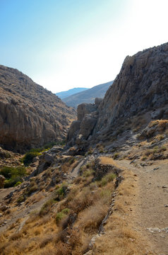 Wadi Kelt or Nahal Prat, in the Judean Desert, Israel. A trail in the rock along the edge of the gorge.