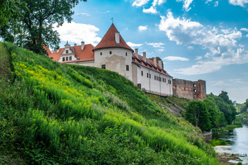 Fototapeta na wymiar Grass bank outside Bauska Castle, Latvia