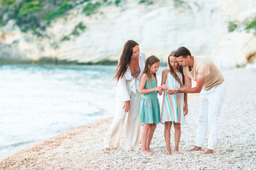 Happy family on the beach during summer vacation