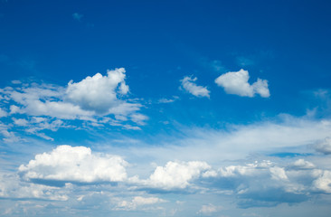 blue sky background with tiny clouds