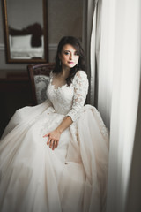 Fototapeta premium Portrait of a beautiful fashion bride, sweet and sensual. Wedding make up and hair